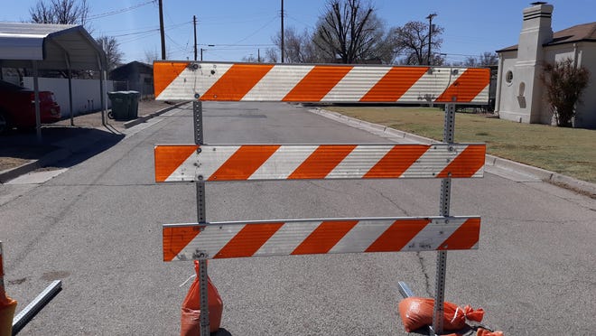 A barricade blocks a side street in Artesia on March 16, 2021. Eddy County Commissioners approved a reallocation of funds for the Eddy County Public Works Department to purchase two message boards to alert commuters during major road construction.