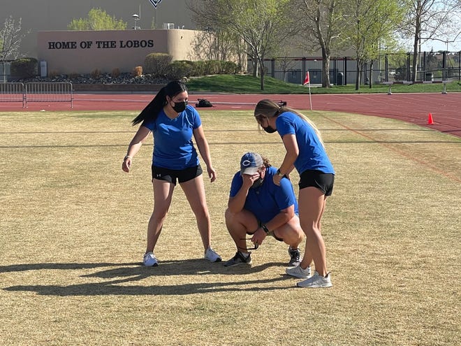 Carlsbad head coach Misty Long, center, holds back tears while assistant coaches Catherine Romero, left, and KK Gonsalez, right, come to celebrate their Class 5A soccer tile on April 10, 2021.