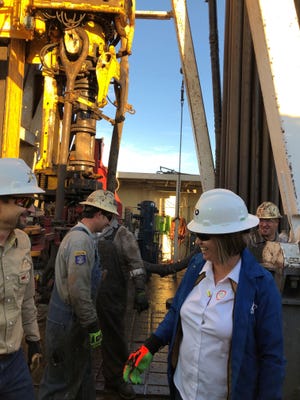 New Mexico State Land Commissioner Stephanie Garcia Richard meets with oil workers at an XTO site, Dec. 4, 2018 in Carlsbad.