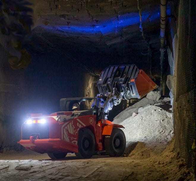 A battery powered load-haul-dump loader moves mined salt in the Waste Isolation Pilot Plant underground.