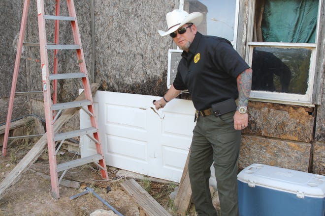 Eddy County Sheriff Mark Cage points to an alleged surveillance camera during a June 12, 2020, drug raid in Carlsbad.