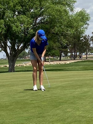 Carlsbad's Cannon Hughes readies for a putt. Hughes is averaging 94.6 strokes per round this season for the Cavegirls.