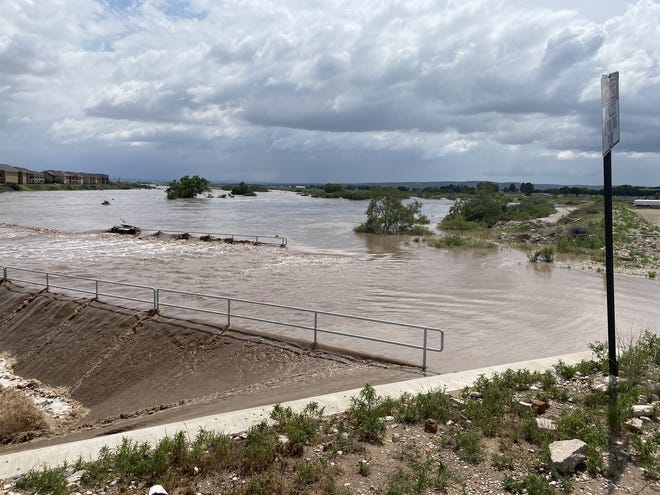 Flooding of Dark Canyon at San Jose Blvd on June 29 closes the intersection and causes flooding of Pecos River in Carlsbad.