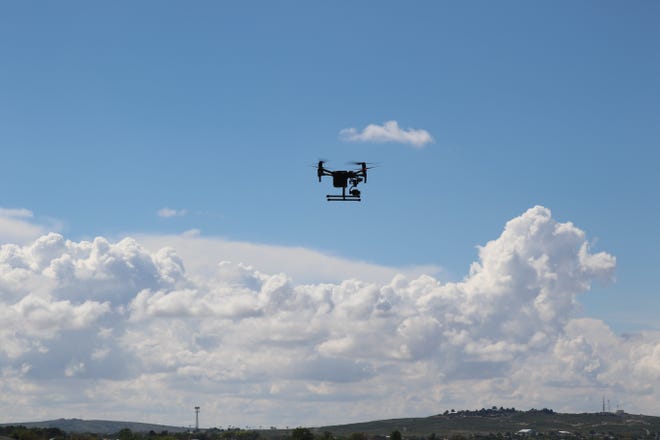 A Carlsbad Fire Department drone takes to the skies over Boyd Drive on June 30, 2021 attempting to locate a missing driver and their vehicle.