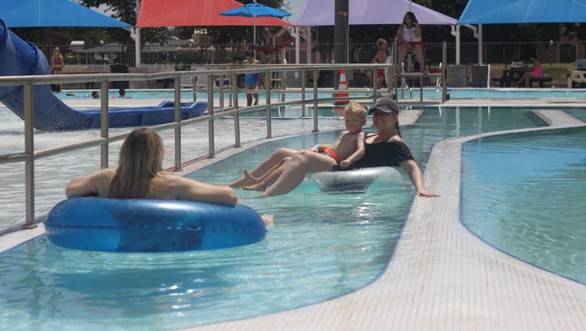 Children from Carlsbad and the surrounding areas cool down in the pools and slides of the Carlsbad Water Park, during the grand opening, May 26, 2018 on Park Drive.