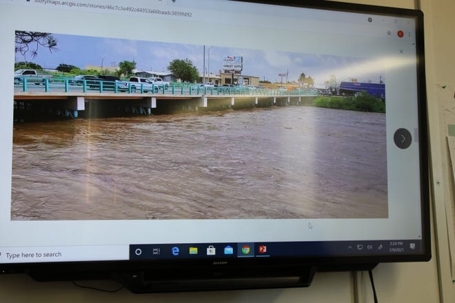 Lt. Gov. Howie Morales and Carlsbad city officials view video of flood waters raging through Carlsbad on June 29, 2021.