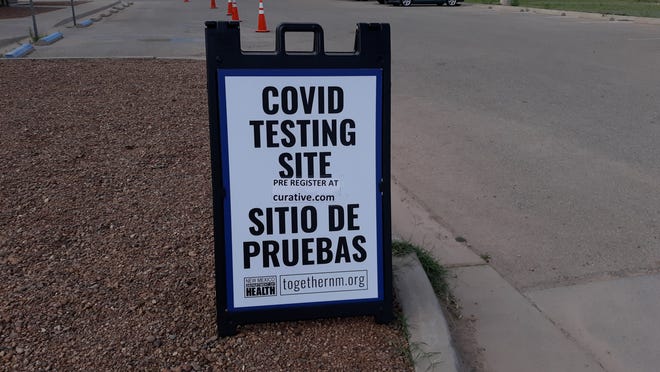 A sign at the Eddy County Public Health Office in Artesia reminds people to register for COVID-19 testing.