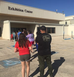 Carlsbad residents wait in line Aug. 27, 2021 at the Walter Gerrells Exhibition Center to receive their  COVID-19 vaccinations.