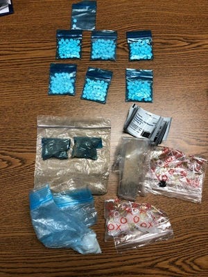 Pecos Valley Drug Task Force displays some items allegedly seized during an arrest on Feb. 15, 2021 in Carlsbad.