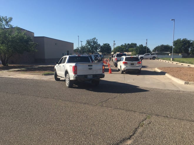 Vehicles wait for COVID-19 tests and vaccinations Aug. 26, 2021 at the Eddy County Public Health Office in Artesia. New Mexico Department of Health said vaccination rates in Eddy County increased from early August.