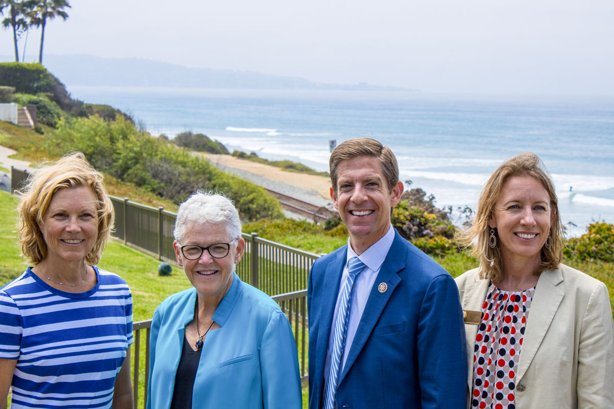 Pictured from left to right, Del Mar Mayor Terry Gaasterland, White House National Climate Advisor Gina McCarthy, Rep. Mike Levin and Encinitas Mayor Catherine Blakespear stop for a picture after a joint press conference Tuesday morning at Seagrove Park in Del Mar. Photo by bill Slane