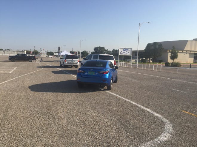 Cars line up for COVID-19 testing in Artesia on Sept. 14, 2021.