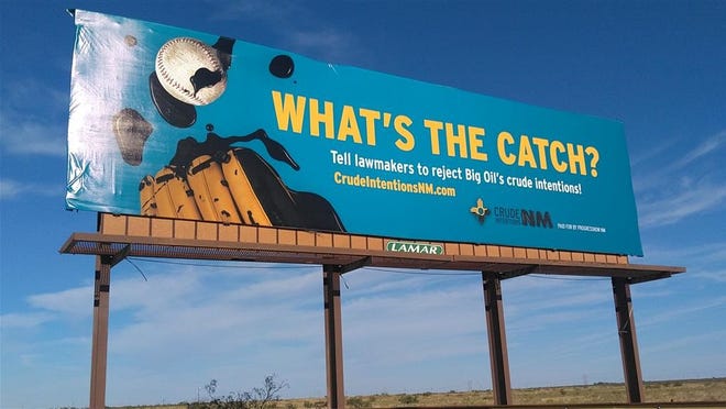 A billboard posted by Progress Now New Mexico about oil and gas concerns in Carlsbad, New Mexico.