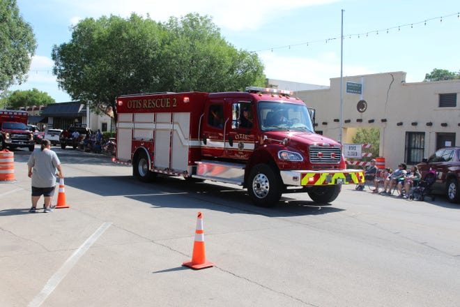 A unit from the Otis Volunteer Fire Department rides through the Independence Day parade on July 3, 2021 in Carlsbad.